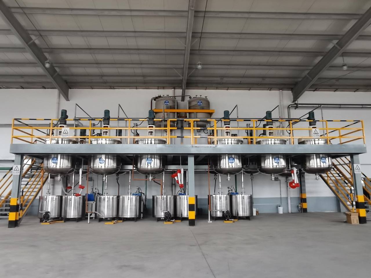 Stainless steel mixing tanks on the compounding platform